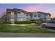 Charming two-story condominium with lawn, shrubbery, and designated handicap parking space at 2608 Hidden Cove Dr, Moncks Corner, SC 29461