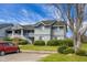 Two story condo building with well manicured landscaping, lawn, and parking area at 2608 Hidden Cove Dr, Moncks Corner, SC 29461