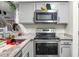 Kitchen area with stainless steel appliances, granite countertops, and a modern electric range at 2608 Hidden Cove Dr, Moncks Corner, SC 29461