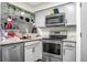 Updated kitchen with stainless steel appliances and light countertops at 2608 Hidden Cove Dr, Moncks Corner, SC 29461