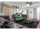 Bright living room with hardwood floors, bar seating, and large windows at 2608 Hidden Cove Dr, Moncks Corner, SC 29461