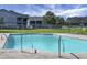 Community pool with crystal blue water and stainless steel hand rails for accessibility at 2608 Hidden Cove Dr, Moncks Corner, SC 29461