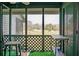 Charming screened-in porch with view of lawn at 2608 Hidden Cove Dr, Moncks Corner, SC 29461
