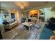 Comfortable living room flows into the kitchen, with stylish furniture and an eye-catching rug at 276 Alexandra Dr # 6, Mount Pleasant, SC 29464