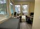 Bright home office featuring large windows, modern decor, and a dedicated workspace with laminate flooring at 276 Alexandra Dr # 6, Mount Pleasant, SC 29464