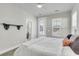 Inviting bedroom featuring an ensuite bathroom, ceiling fan, and plenty of natural light at 326 Ripple Park Dr, Summerville, SC 29486