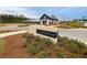 Beautiful Midtown Club clubhouse entrance with manicured landscaping and a paved entryway for a welcoming neighborhood at 326 Ripple Park Dr, Summerville, SC 29486
