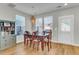 Cozy dining room with natural light, classic table and chairs, plus attractive shelving at 326 Ripple Park Dr, Summerville, SC 29486
