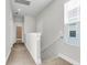 Bright and open hallway with carpet flooring, white trim, and natural light streaming in at 326 Ripple Park Dr, Summerville, SC 29486