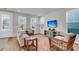 Comfortable living room with large windows and stylish decor, perfect for relaxation at 326 Ripple Park Dr, Summerville, SC 29486