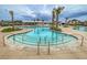 The sprawling swimming pool with palm trees offers a refreshing community space for relaxation and recreation at 326 Ripple Park Dr, Summerville, SC 29486