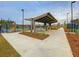 Shaded outdoor pavilion and manicured greenery provides community gathering and relaxation near the tennis courts at 326 Ripple Park Dr, Summerville, SC 29486