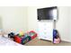 bedroom featuring cartoon-themed decor, a flat-screen TV, and a white dresser at 3406 Mariners Way, Moncks Corner, SC 29461