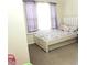 Bright bedroom with a white bed frame, a unicorn pillow and a large window at 3406 Mariners Way, Moncks Corner, SC 29461