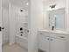 Bright bathroom with a white vanity, modern fixtures, and a tub with shower at 351 Blue Oak Dr, Moncks Corner, SC 29461