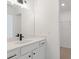 Bright bathroom featuring modern fixtures and a vanity with mirror, as well as a view to the closet at 351 Blue Oak Dr, Moncks Corner, SC 29461