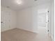 Bright, empty bedroom with neutral carpet, and a view to another room with bright window at 351 Blue Oak Dr, Moncks Corner, SC 29461