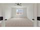 Comfortable bedroom features neutral carpeting, a bright window, and an open doorway at 351 Blue Oak Dr, Moncks Corner, SC 29461