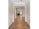 Inviting hallway with decorative trim and hardwood floors at 351 Blue Oak Dr, Moncks Corner, SC 29461
