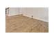 Light hardwood floors with neutral colored baseboards for a clean and modern style at 351 Blue Oak Dr, Moncks Corner, SC 29461