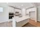 Modern kitchen with white cabinets, center island, and stainless appliances at 351 Blue Oak Dr, Moncks Corner, SC 29461