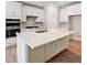 Island kitchen with white cabinets and hardwood floors at 351 Blue Oak Dr, Moncks Corner, SC 29461
