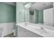 Bright bathroom features double vanity with white cabinetry, a large mirror, and tile flooring at 3518 Gatetree Rd, Johns Island, SC 29455