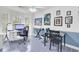 Bright dining space features artwork, a keyboard, and a cozy work-from-home setup at 3518 Gatetree Rd, Johns Island, SC 29455