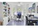 Bright dining area boasts a built-in bookshelf, piano, and a cozy work-from-home space at 3518 Gatetree Rd, Johns Island, SC 29455