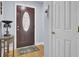 Welcoming foyer with hardwood floors, a decorative table, and a dark wood front door at 3518 Gatetree Rd, Johns Island, SC 29455