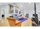 Spacious living room featuring hardwood floors, high ceilings, and stylish decor at 3518 Gatetree Rd, Johns Island, SC 29455