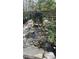 Close up view of the lovely outdoor stone water feature at 3518 Gatetree Rd, Johns Island, SC 29455