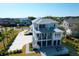Beautiful coastal property with balconies, outdoor fire pit, well manicured lawn, and driveway at 4176 Victory Pointe Dr, Mount Pleasant, SC 29466