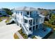 Stunning coastal home featuring multiple balconies, outdoor fire pit and three car garage at 4176 Victory Pointe Dr, Mount Pleasant, SC 29466