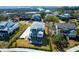 Stunning aerial view showcases the coastal neighborhood with lush green lawns and beautiful marsh views at 4176 Victory Pointe Dr, Mount Pleasant, SC 29466
