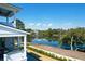 Beautiful backyard view of a tranquil lake surrounded by lush greenery from the outdoor living space at 4176 Victory Pointe Dr, Mount Pleasant, SC 29466