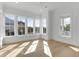 Bedroom filled with natural light with many windows, hardwood floors and bright white trim at 4176 Victory Pointe Dr, Mount Pleasant, SC 29466