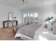 Bright bedroom with hardwood floors and access to a private balcony overlooking the water at 4176 Victory Pointe Dr, Mount Pleasant, SC 29466