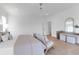 Spacious bedroom with hardwood floors, neutral decor, and a custom-built console at 4176 Victory Pointe Dr, Mount Pleasant, SC 29466