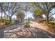 Elegant gated community entrance with mature trees and landscaping welcomes residents and guests at 4176 Victory Pointe Dr, Mount Pleasant, SC 29466
