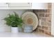 Close-up of a pristine white countertop, decorated with a fern, basket and set of bowls at 4176 Victory Pointe Dr, Mount Pleasant, SC 29466