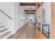 Bright entryway features wood floors, shiplap walls, exposed beams, and transom windows for natural light at 4176 Victory Pointe Dr, Mount Pleasant, SC 29466