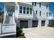 Elegant home featuring a three car garage with multiple stories and outdoor stairway at 4176 Victory Pointe Dr, Mount Pleasant, SC 29466