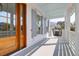 Inviting front porch with wooden door, white railings, and blue ceiling, perfect for relaxing outdoors at 4176 Victory Pointe Dr, Mount Pleasant, SC 29466