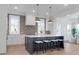 Bright kitchen features brick accent wall, a large center island, and modern lighting fixtures at 4176 Victory Pointe Dr, Mount Pleasant, SC 29466