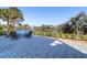 An outdoor patio with a modern fire pit and inviting lounge chairs, offering a peaceful retreat with lake views at 4176 Victory Pointe Dr, Mount Pleasant, SC 29466