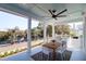 Outdoor porch features a lake view and outdoor kitchen, a perfect spot for entertaining and grilling at 4176 Victory Pointe Dr, Mount Pleasant, SC 29466