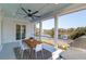 Outdoor porch with a ceiling fan provides shade and a beautiful view of the water, perfect for leisure at 4176 Victory Pointe Dr, Mount Pleasant, SC 29466