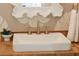 Powder room boasts a rustic wood vanity and a leafy patterned wallpaper, with a modern sink and fixtures at 4176 Victory Pointe Dr, Mount Pleasant, SC 29466