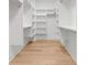 Walk-in closet with custom shelves and wood flooring providing ample storage space at 4176 Victory Pointe Dr, Mount Pleasant, SC 29466